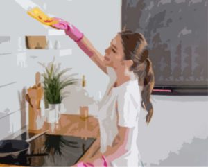 woman cleaning a home office