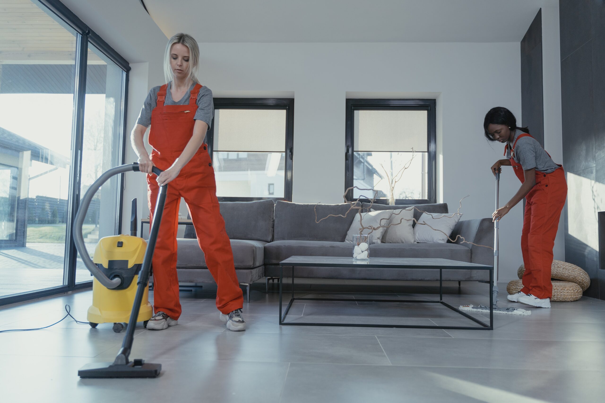 professional cleaners cleaning rental property
